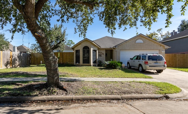 16418 Red Oak Dr, Missouri City, TX 77489 - ranch-style house featuring a garage and a front lawn