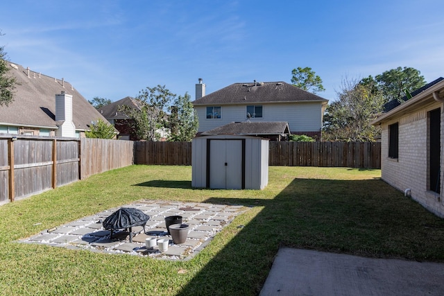 16418 Red Oak Dr, Missouri City, TX 77489 - view of yard with a storage unit and a patio area