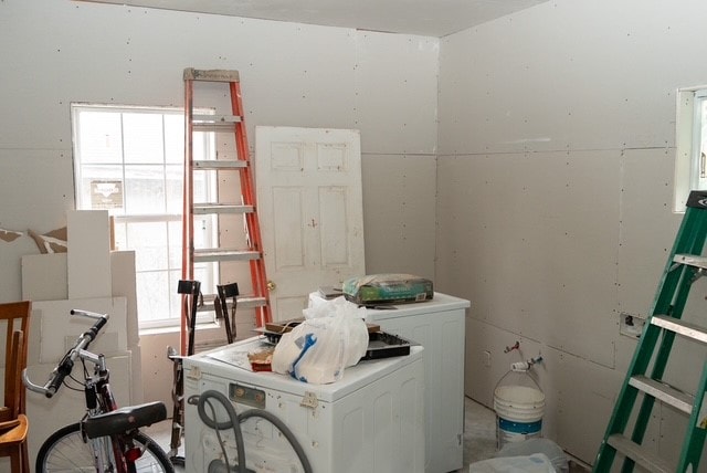 laundry room featuring washer / dryer and a healthy amount of sunlight