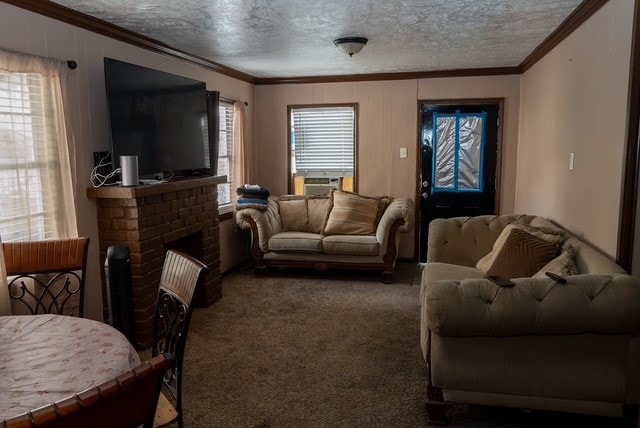 living room featuring a wealth of natural light, crown molding, carpet, and a textured ceiling