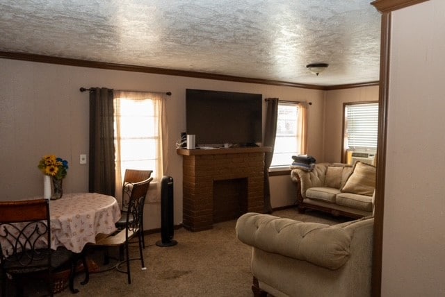 living room featuring light carpet, a brick fireplace, a textured ceiling, cooling unit, and crown molding