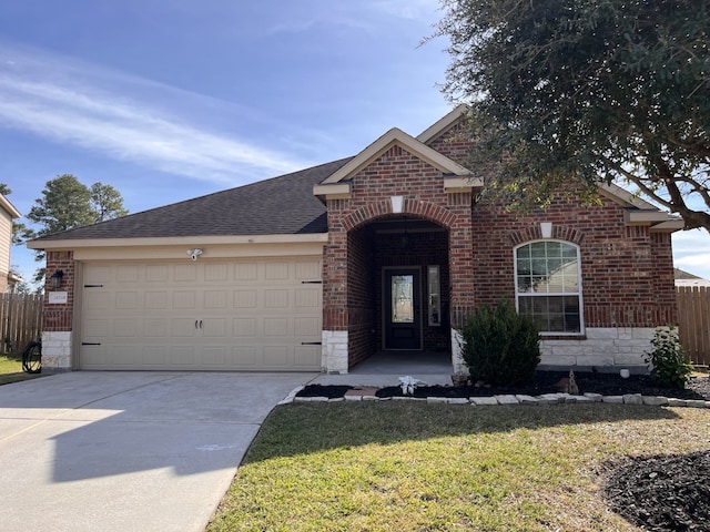 view of front of house with a garage and a front yard