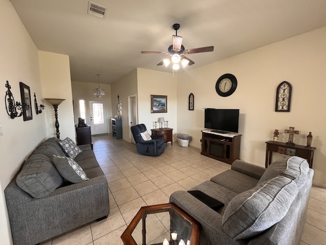 tiled living room featuring ceiling fan