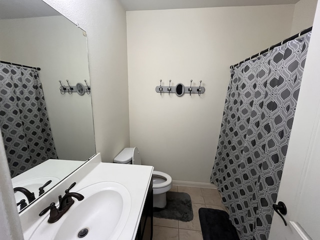 bathroom with tile patterned floors, vanity, and toilet