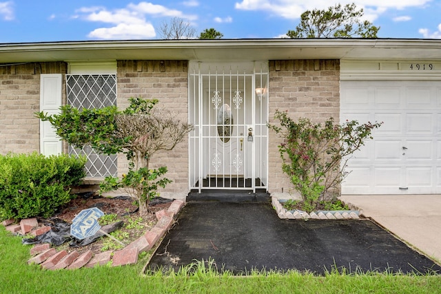 doorway to property featuring a garage