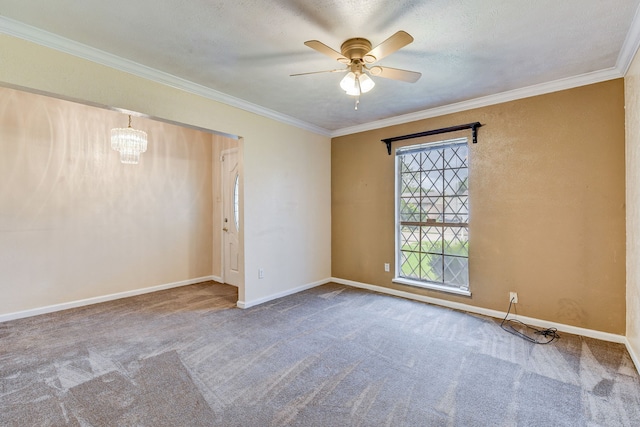 empty room featuring carpet flooring, a textured ceiling, ceiling fan with notable chandelier, and crown molding