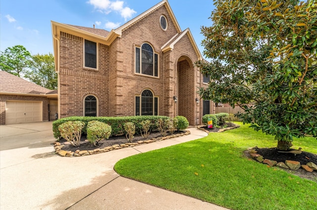 view of front property with a front yard and a garage