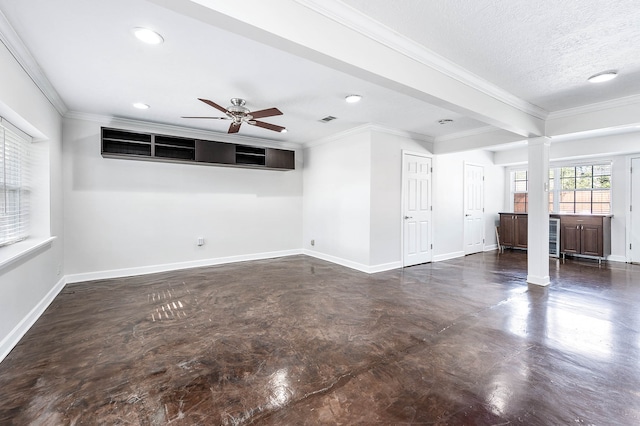 unfurnished room featuring ceiling fan, ornamental molding, and a textured ceiling