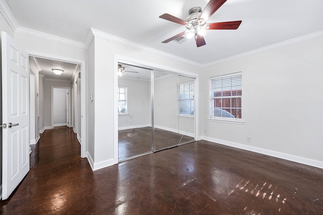 unfurnished bedroom featuring ceiling fan, a closet, and ornamental molding