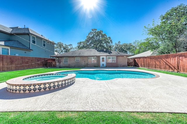 view of swimming pool featuring an in ground hot tub