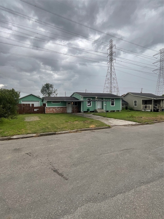 single story home with a front yard