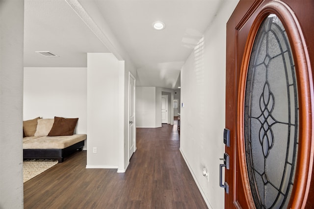 corridor featuring dark hardwood / wood-style flooring