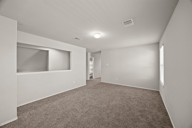 unfurnished room with carpet floors