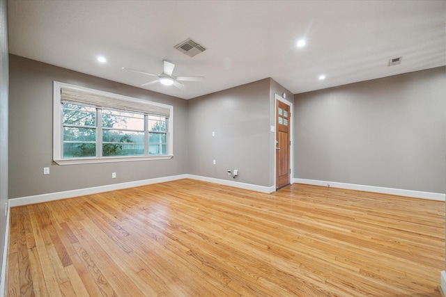 spare room with ceiling fan and light hardwood / wood-style floors