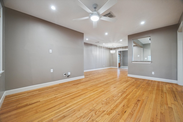 unfurnished living room featuring light hardwood / wood-style flooring and ceiling fan