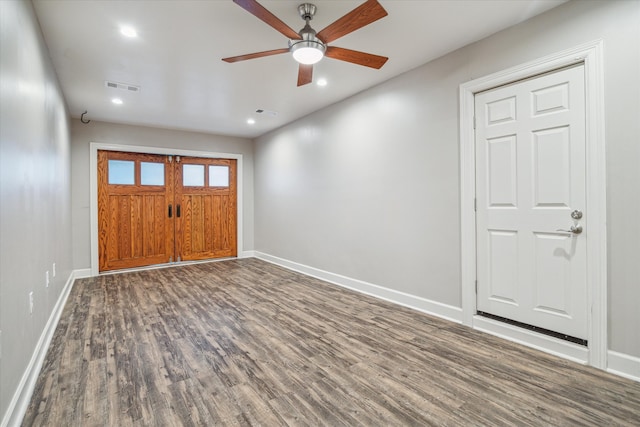 foyer featuring ceiling fan and dark wood-type flooring