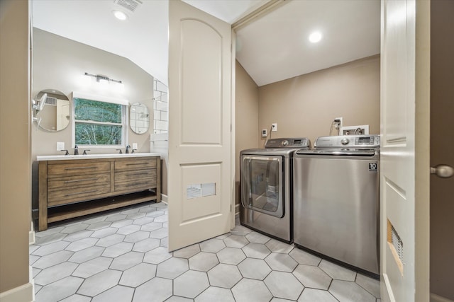 laundry room featuring washer and clothes dryer and sink