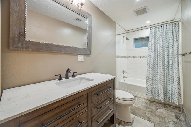 full bathroom featuring a textured ceiling, vanity, toilet, and shower / bathtub combination with curtain