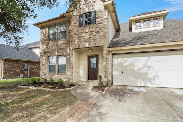 view of front of home with a garage