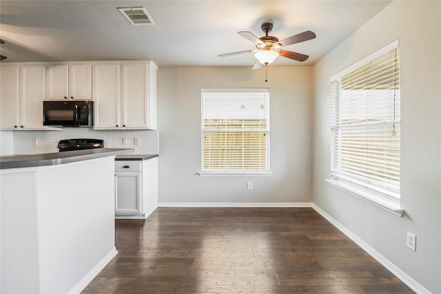 kitchen with white cabinetry, decorative backsplash, a healthy amount of sunlight, and black appliances