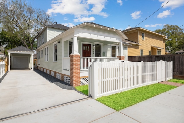 view of front of property featuring an outbuilding, a porch, and a garage