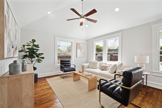 living room featuring wood-type flooring, high vaulted ceiling, and ceiling fan