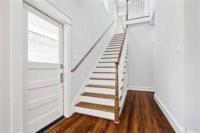 stairs featuring hardwood / wood-style flooring