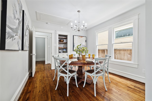 dining room with a notable chandelier and wood-type flooring