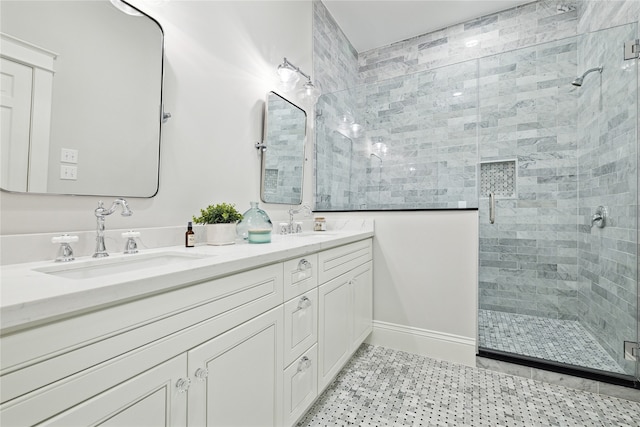 bathroom with a shower with door and vanity