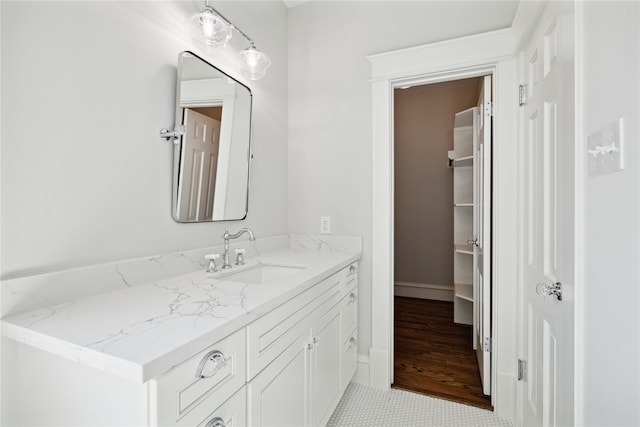 bathroom featuring tile patterned flooring and vanity