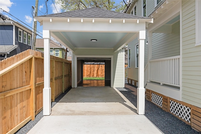 view of parking / parking lot featuring a carport