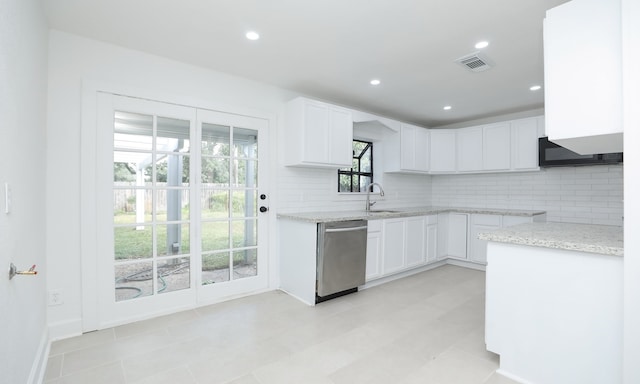 kitchen with white cabinetry, dishwasher, sink, and backsplash