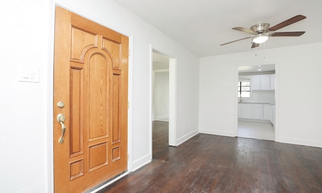 entryway featuring ceiling fan and dark hardwood / wood-style flooring