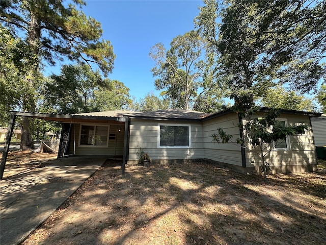 view of front of home featuring a carport