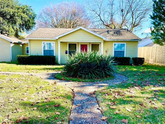 ranch-style home with a front yard