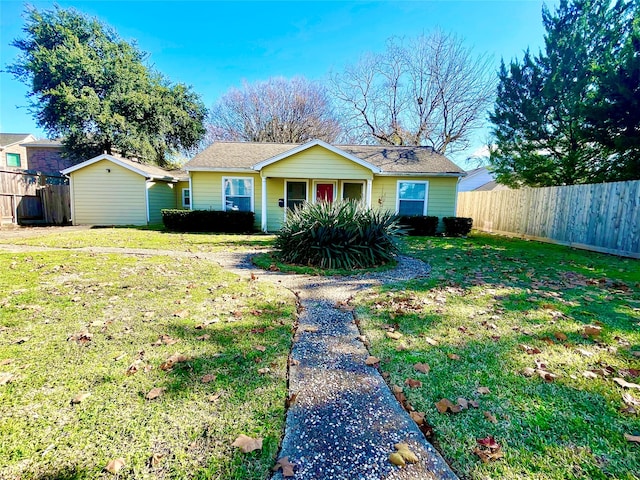 ranch-style home with a front yard