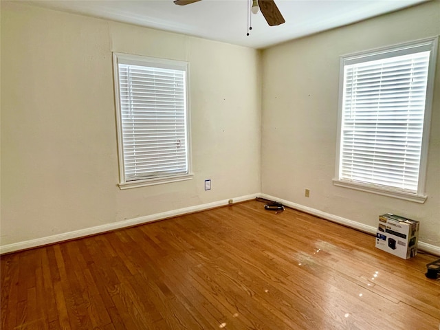 unfurnished room featuring ceiling fan and wood-type flooring