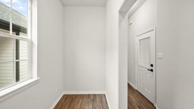 corridor with dark wood-type flooring