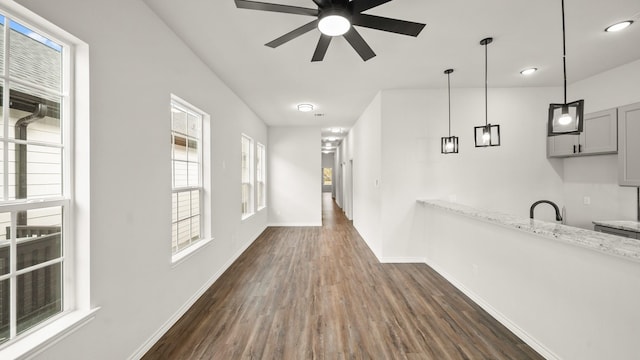 hallway with sink and dark hardwood / wood-style floors