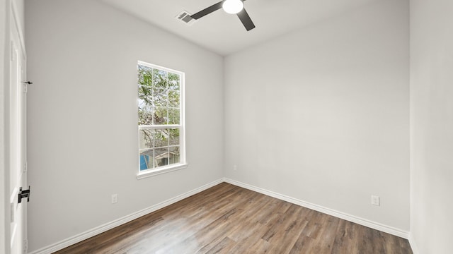 unfurnished room with hardwood / wood-style floors and ceiling fan