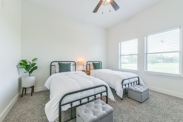 bedroom with ceiling fan and carpet floors