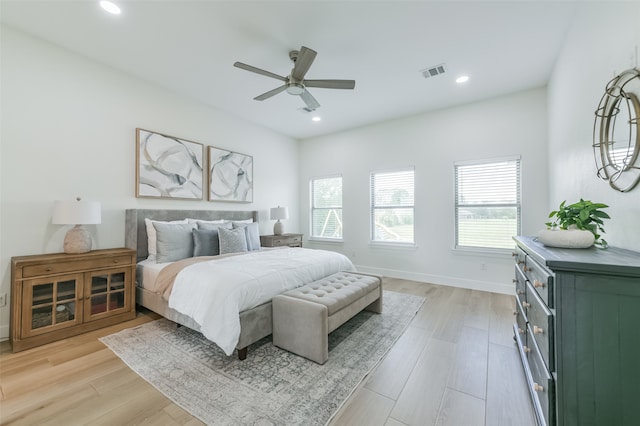 bedroom with light wood-type flooring and ceiling fan