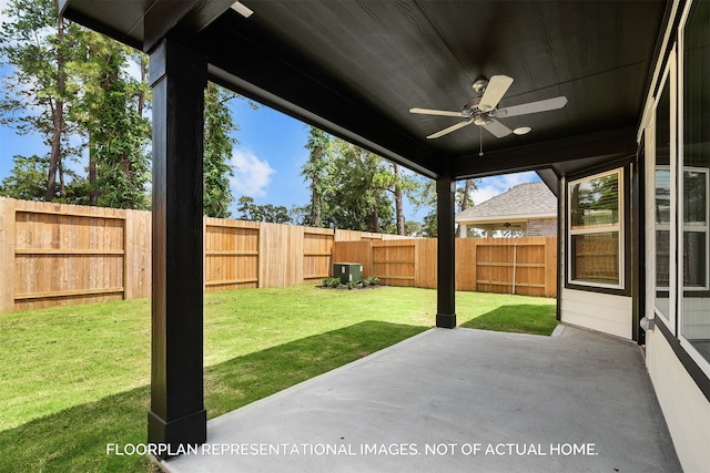 view of yard featuring ceiling fan and a patio