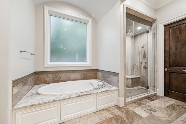 bathroom with independent shower and bath and ornamental molding