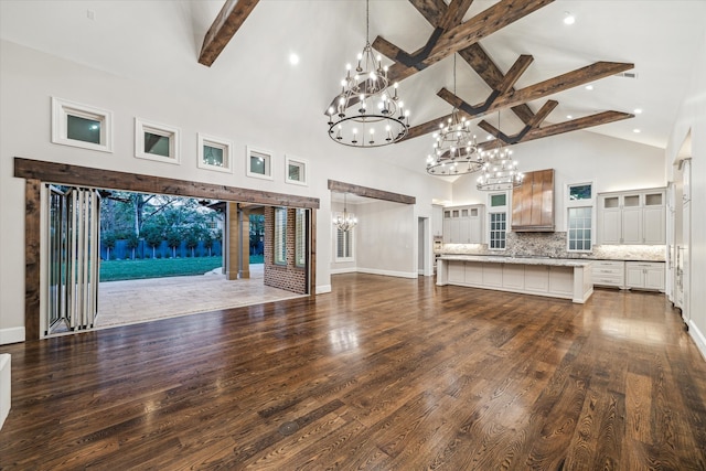 unfurnished living room with beamed ceiling, dark wood-type flooring, and high vaulted ceiling