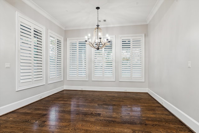 unfurnished dining area featuring crown molding, dark wood-type flooring, and a notable chandelier