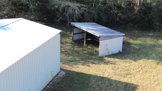 view of outdoor structure with a lawn