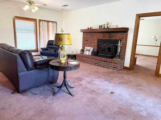 living room featuring ceiling fan and carpet floors