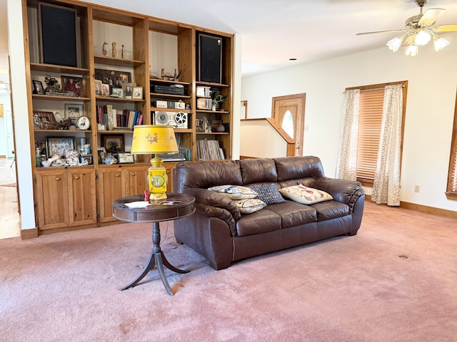 living room with light carpet and ceiling fan