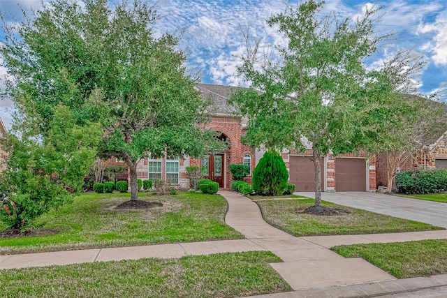 obstructed view of property with a front lawn and a garage